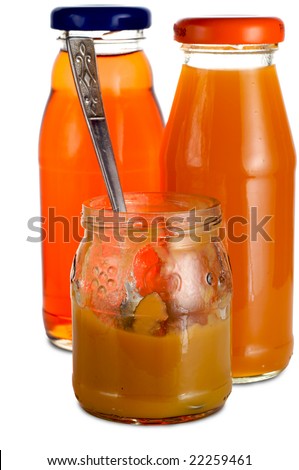 Two bottles of plum and peach juice. Jars with fruit puree. The bank - spoon. Isolated on a white background.