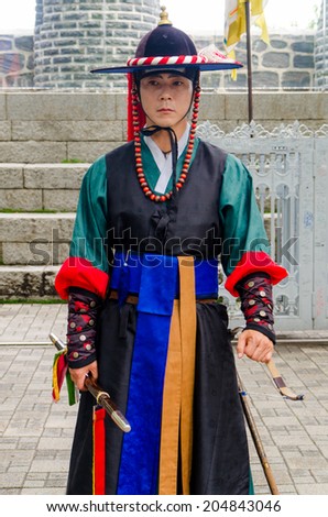 SEOUL, SOUTH KOREA - JUNE 22: Royal guard on June 22, 2014, Seoul, South Korea. Guards in medieval clothes had been protected the Gyeongbok Palace for centuries. This palace is a world heritage site.