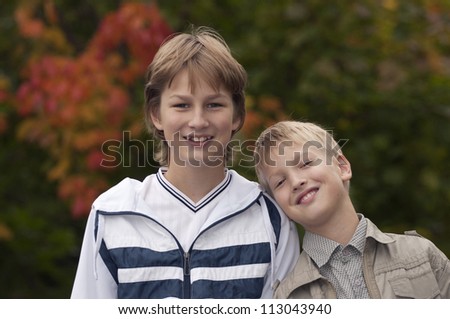 Happy brothers having fun in park