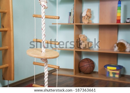Sport rope against toys background.Interior of childrens room