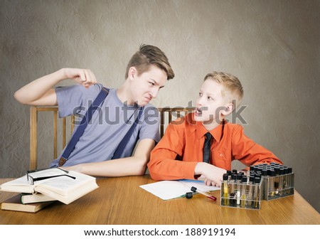 Boys conflict . Experiences with test tubes
