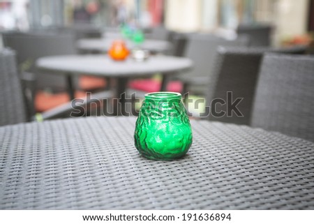 Candle on a table of summer cafe