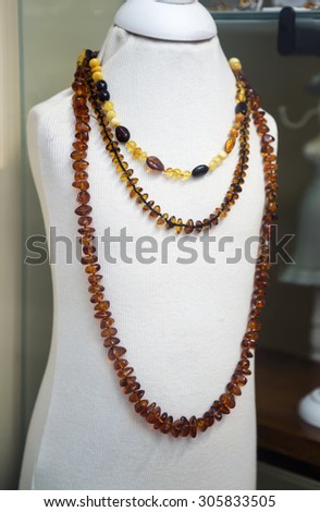 Amber jewelry in a shop window closeup
