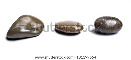 Five stones on concrete ground