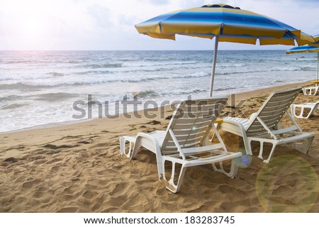 lounger parasol beach sea sky