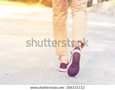 woman sunny walk legs gumshoes