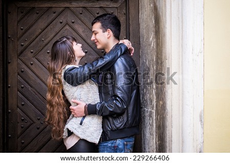 Romantic couple hugging door man woman