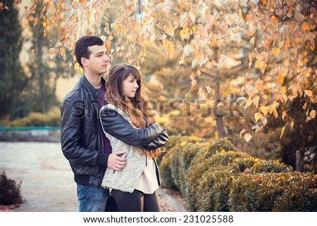 man woman couple cuddling autumn