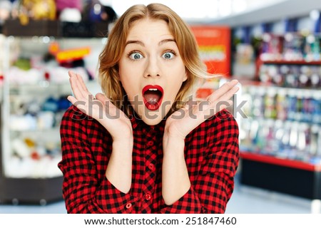 Surprised girl in the shop
