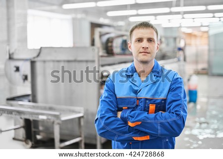 Portrait of a male Laundry worker at the dry cleaners