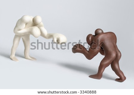 Two plasticine boxing man figures