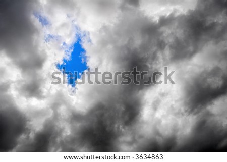 A fragment of a clear sky through the overcast