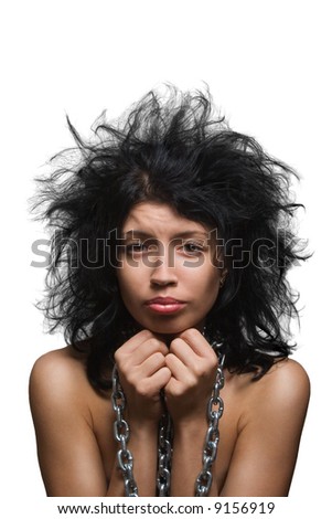 stock photo Uncombed suffering blackhaired girl in chains on a white
