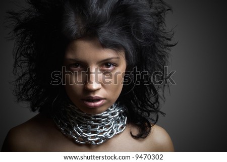 stock photo Blackhaired girl in chains