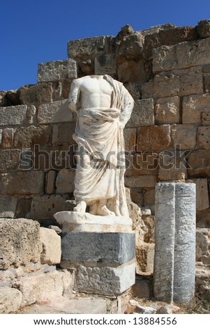 Headless sculpture of an ancient god on the ruins of town Salamis, Northern Cyprus