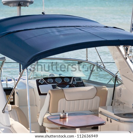 yacht cabin interior with table and dashboard