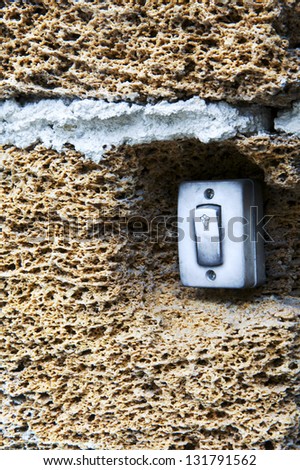 bell push in shell rock blocks wall