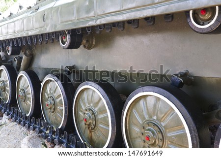 military vehicles running gear on tracks closeup