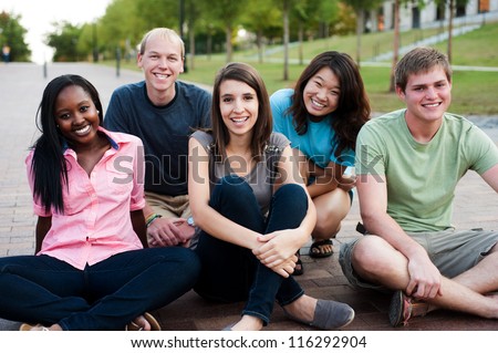 Diverse group of friends outside smiling together