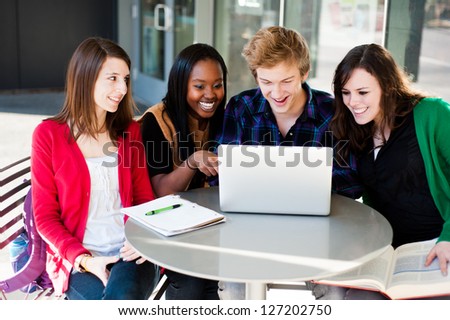 Group of Diverse Students Outside studying