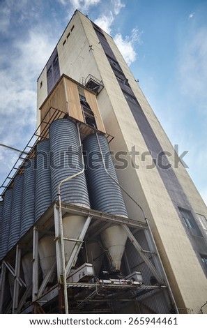 Old factory exterior with a high-rise manufacturing building in Finland. This majestic old industrial building is not in use anymore. Very strong perspective from low angle view.