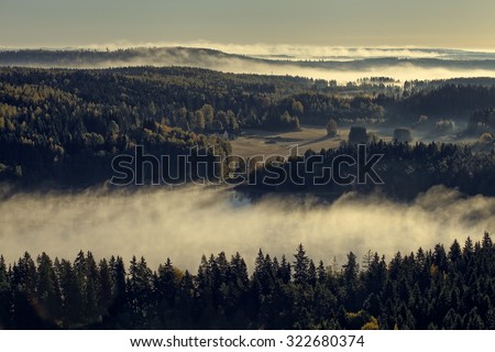 Peaceful landscape of Aulanko nature reserve park in Finland. Thick fog covering the scenery in the early morning. HDR image.