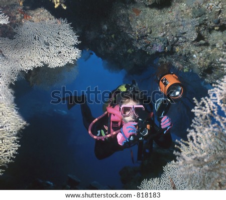 Female underwater photographer, Custom cave, Solomon Islands