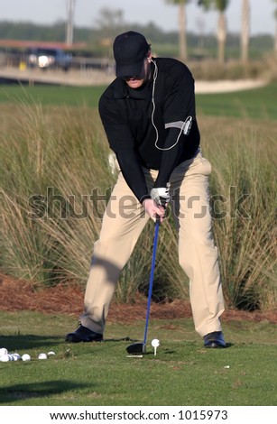 Long Driver contestant in the Player\'s Tour tournament practices, illustrating a perfect set up.