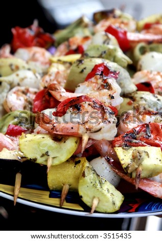 Delicious shrimp, onion, tortellini, yellow squash, red bell pepper, and artichoke hearts kabobs marinated in an lemon tarragon sauce