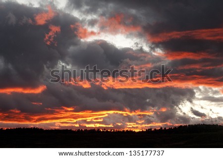 Big Sky Country as storm clouds lift at sunset/Radiant Sky/Here on the Colorado Plateau, where the wind keeps rolling, the storm clouds fill the sky and the sunset makes it all come alive.