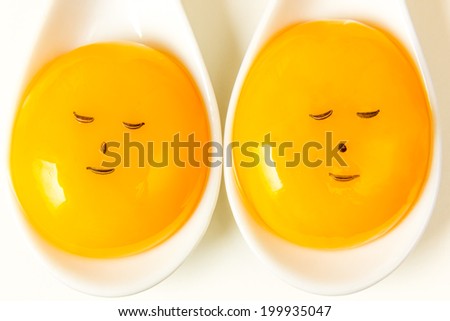Egg yolk closeup on white