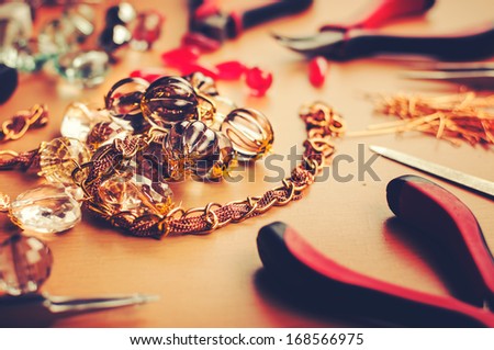 Jewelry making tools on table.