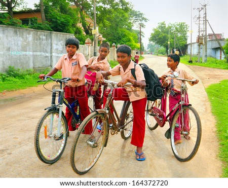 Kanchi, India - Aug 16: Unidentified Hindu School Children Dressed In Uniform Go Home After Classes By Their Bicycles On August 16, 2013 In Kanchipuram, Tamil Nadu, Southern India