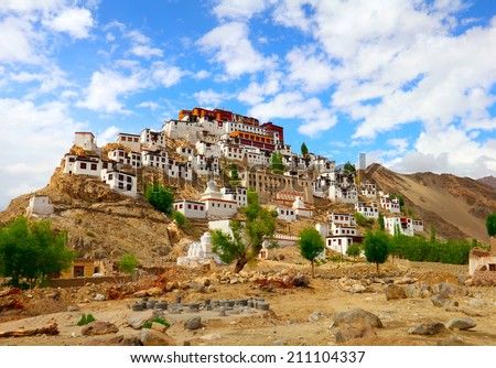 Beautiful scenic view - ancient Thiksey Buddhist Monastery and traditional Tibetan houses against the background of bright blue sky - Leh district, Ladakh, Himalaya, Jammu & Kashmir, Northern India