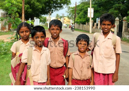 KANCHI, INDIA - AUG 16: Unidentified hindu school children dressed in uniform go home after classes on August 16, 2013 in Kanchipuram, Tamil Nadu, Southern India