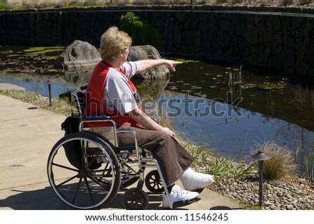 Older woman in a wheel chair at the park