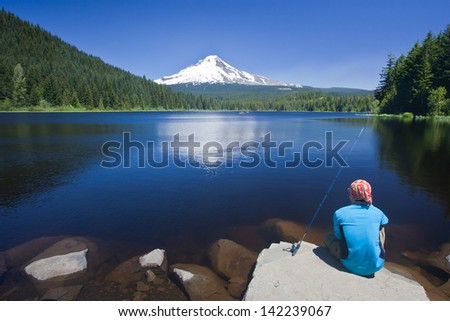Fishing at Trillium Lake, facing Mount Hood