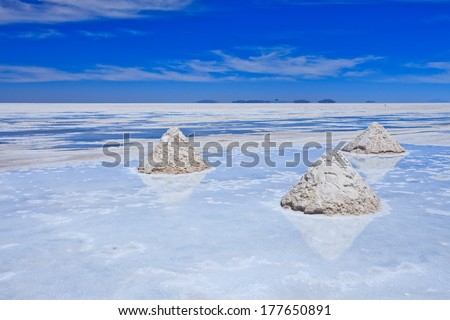 Reflection of salt piles of Salar de Uyuni, World\'s biggest salt flat in Bolovia, South America
