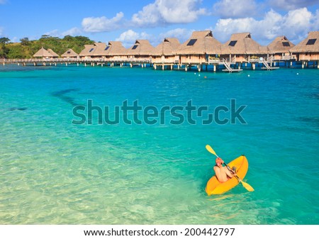 Kayaking in the blue lagoon,   Bora Bora, French Polynesia, South Pacific