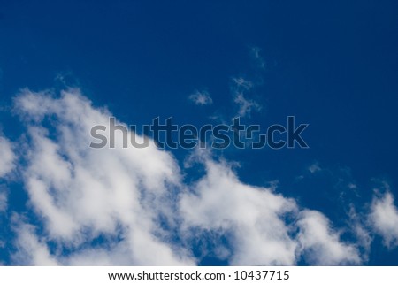 Some puffy cumulus clouds against a pretty blue sky.