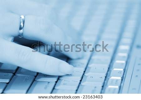 selective focus hand on keyboard