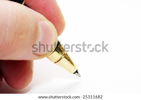 Hand and pen on the white paper
