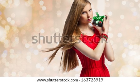 beautiful christmas woman with gifts box