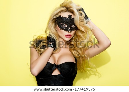 Beauty Model Girl with Carnival Mask.Masquerade Woman.Holiday Dress and Makeup. Fashion Blonde Portrait