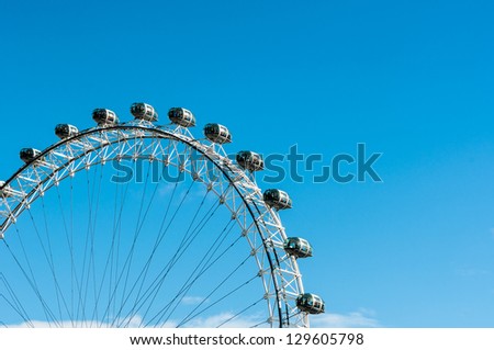 LONDON, ENGLAND - SEPTEMBER 25: London Eye on September 25th 2012 in London. The London Eye is a giant Ferris wheel situated on the banks of the River Thames, in London, England, United Kingdom.