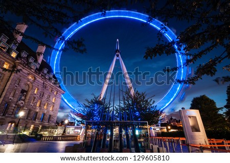 LONDON ENGLAND SEPTEMBER 26 London Eye on September 26th 2012 in London The 135 meter landmark is a giant Ferris wheel situated on the banks of the River Thames in London England LONDON ENGLAND SEPTEMBER 26 London Eye on September 26th 2012 in London The 135 meter landmark is a giant Ferris wheel situated on the banks of the River Thames in London England