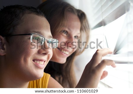 looking out window, handsome, glasses, pretty, couple, window, smile, young, girl, joy, boy, two, fun