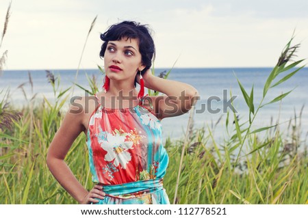 woman with red earrings