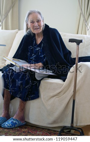 old woman reads book