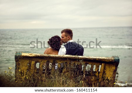 kissing couple on the bench